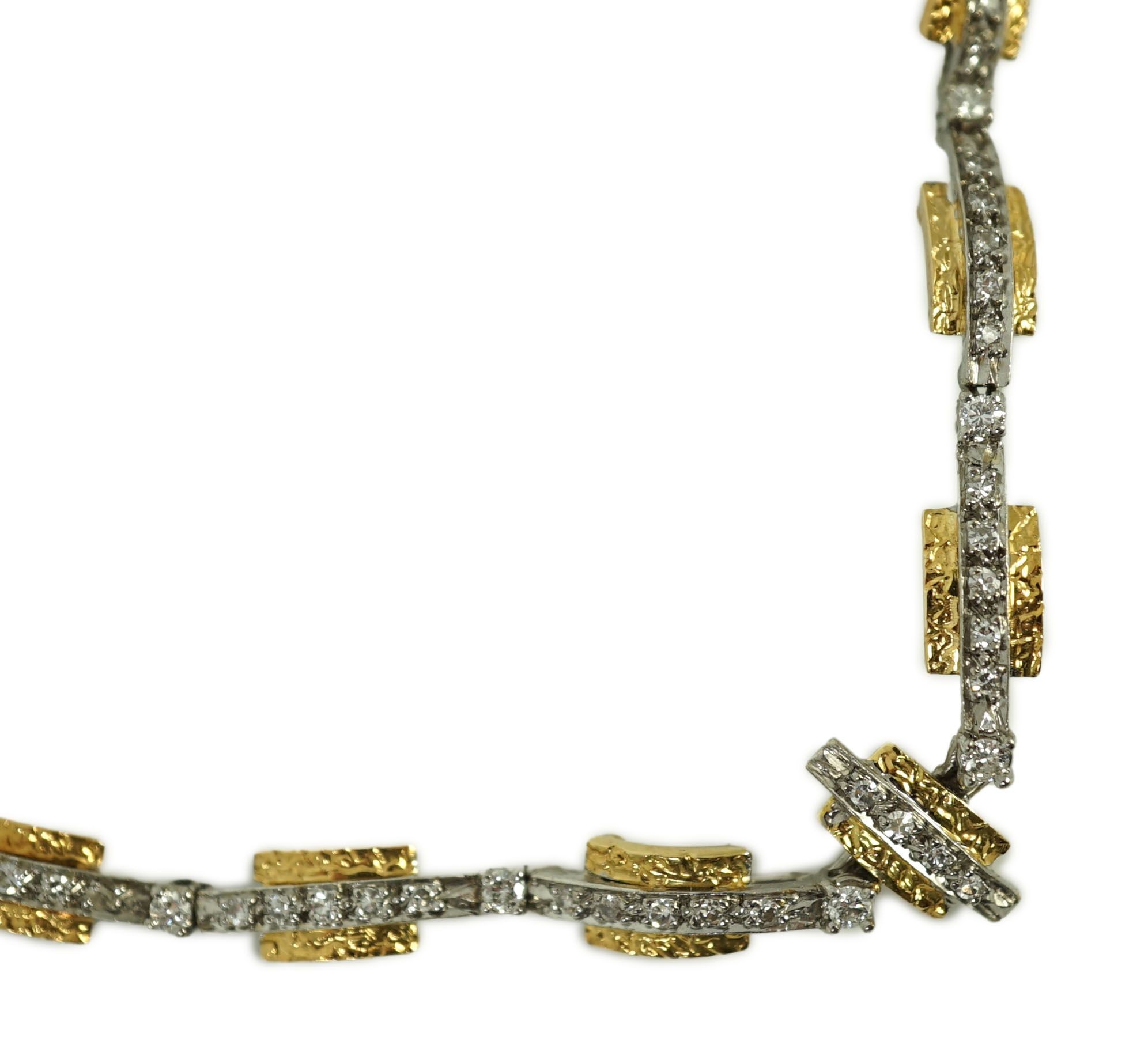 A 20th century two colour gold and diamond set necklace